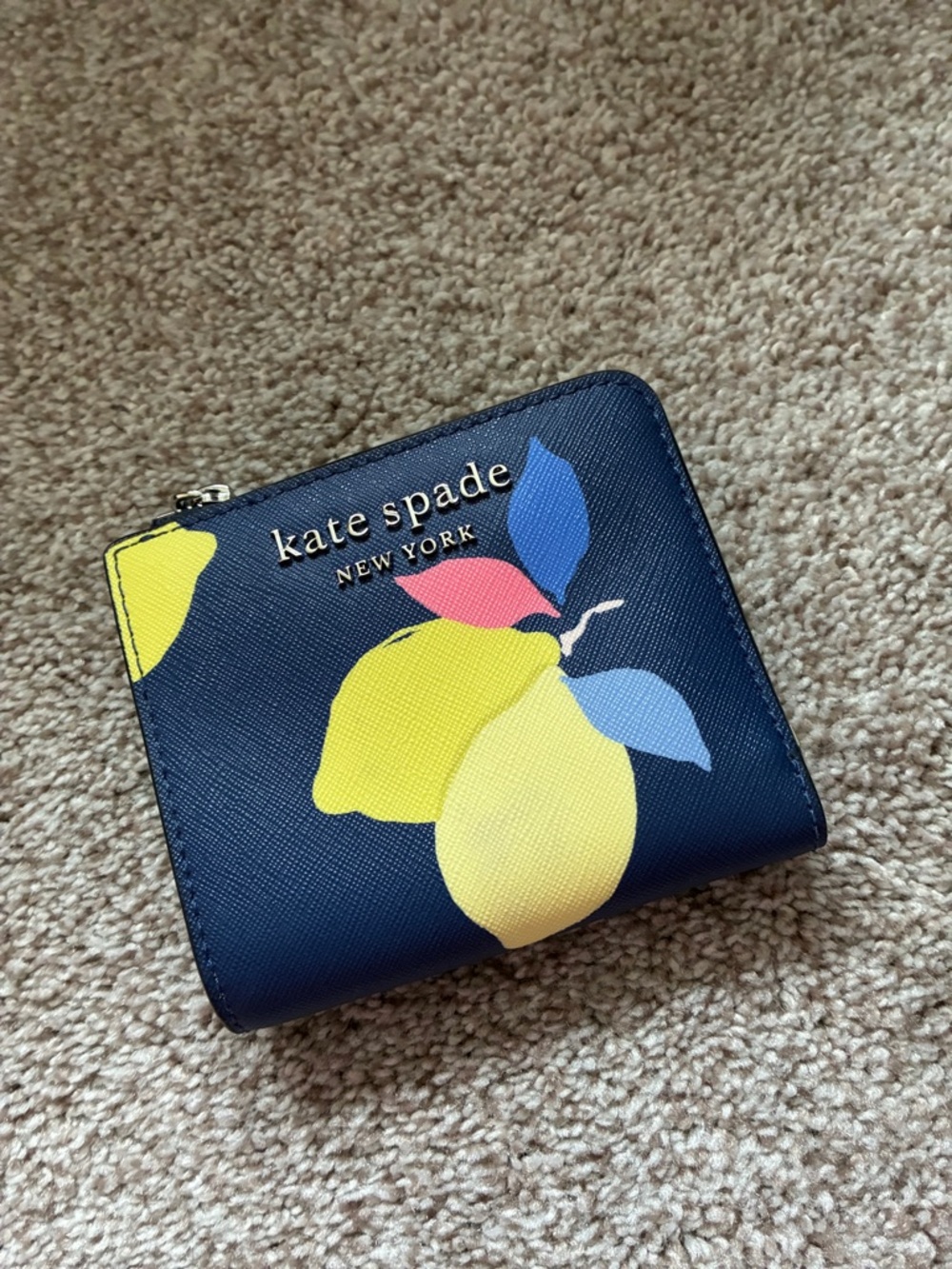 kate spade navy wallet with lemon print and colorful leaves